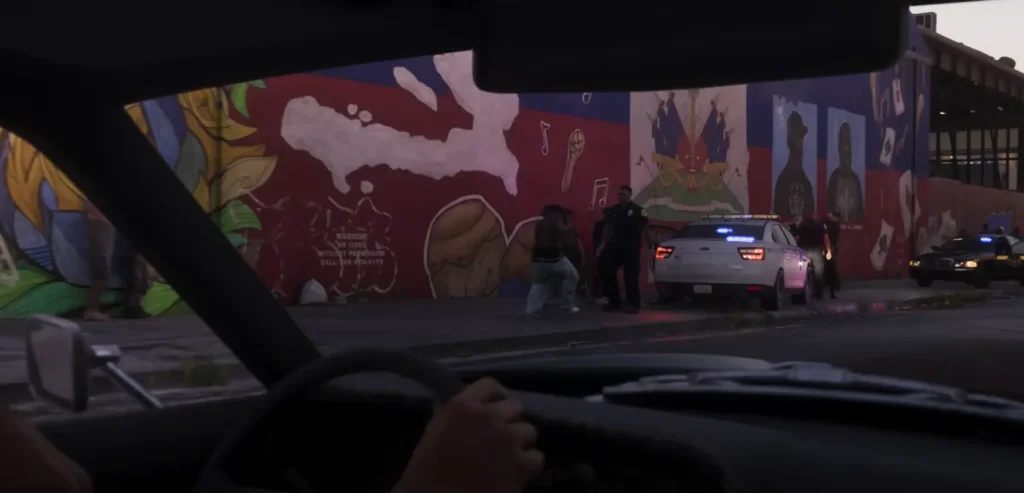 Police confront civilians in a tense street scene from GTA 6 Trailer 2, showcasing Rockstar’s layered depiction of urban life.
